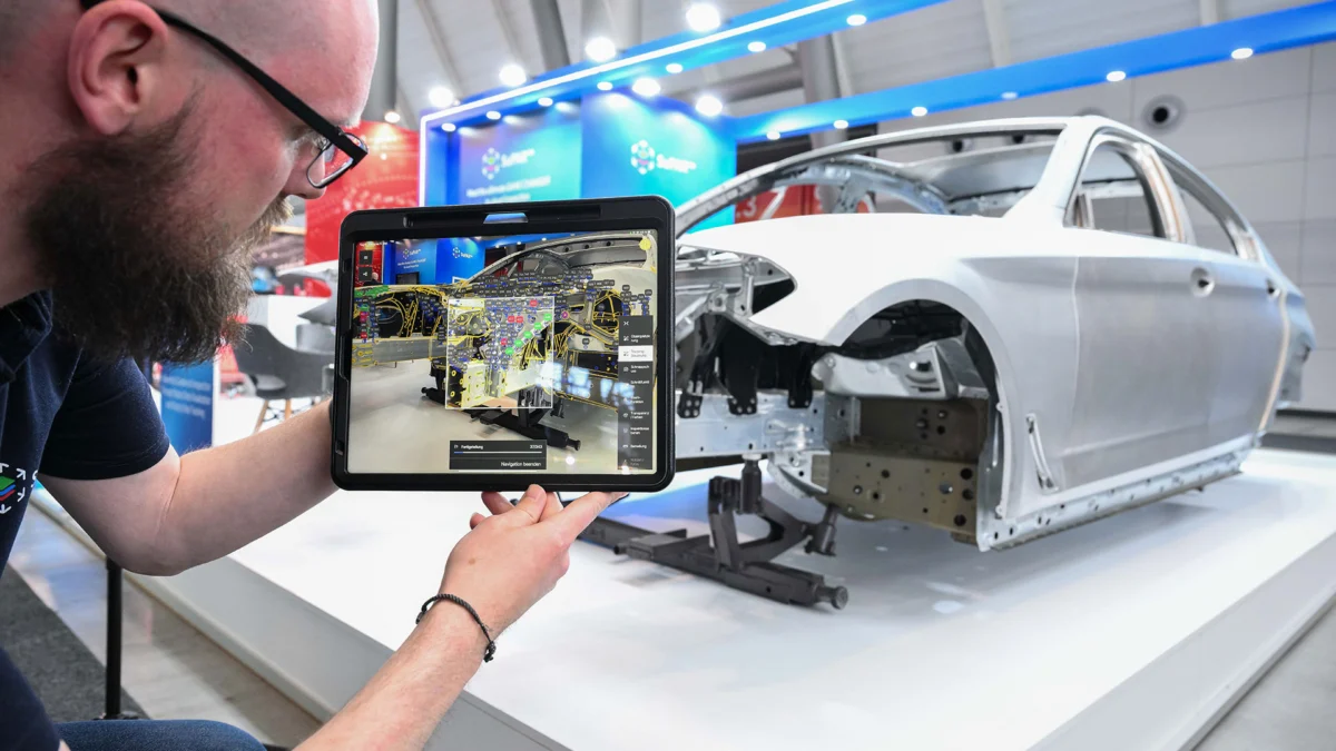 SuPAR augmented reality inspection — iPad overlaying CAD model onto a car body